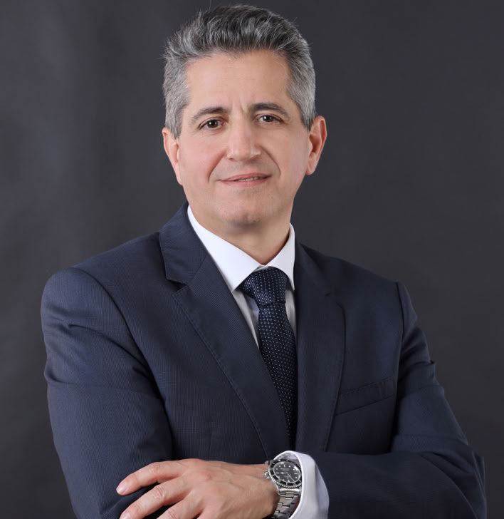 A cute white cat lounging on a piano, showcasing its curious nature and love for music.